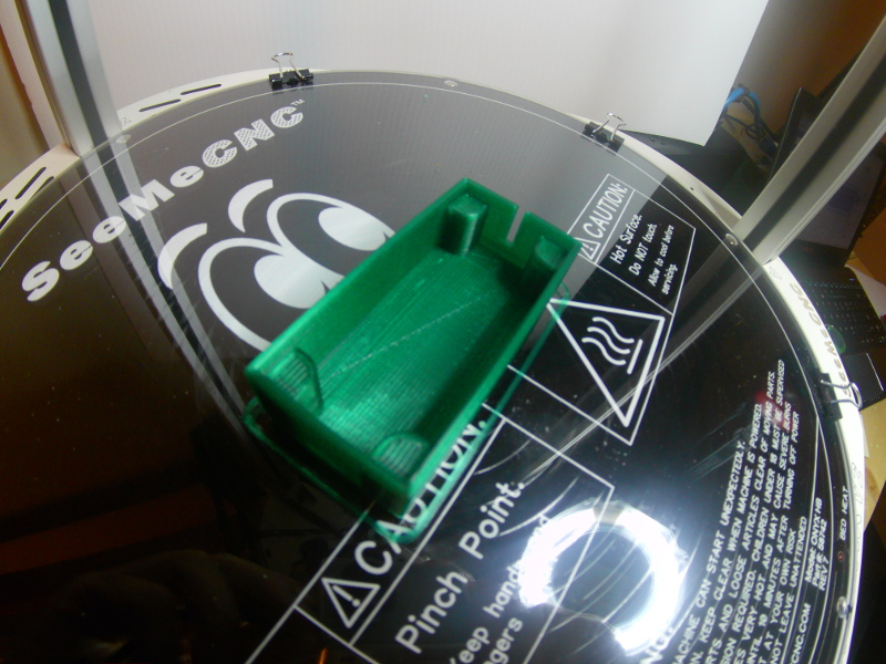A picture of the printed speaker box in dark green plastic